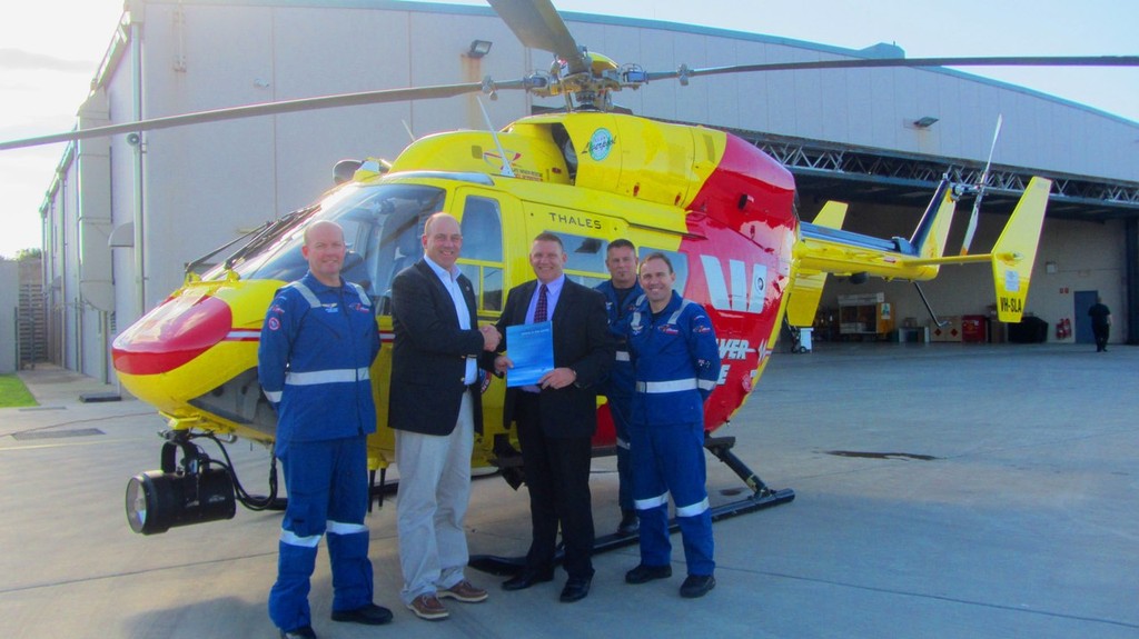 Matt Allen presents cheque to Stephen Lahey CEO Westpac Life Saver Rescue Helicopter with some of the crew © Westpac Life Saver